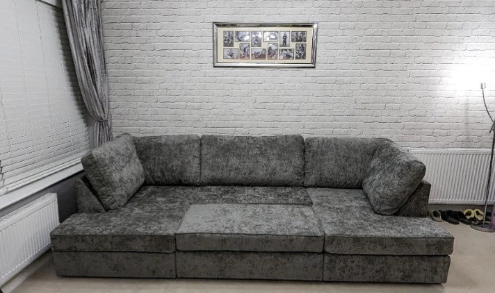 Furnish UK large U shaped sofa for living room in gray fabric with plush cushions and modern design
