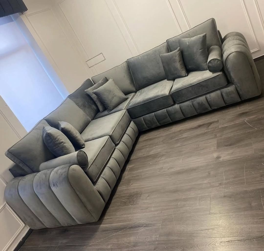 Furnish UK modern L-shaped sofa corner sofa in gray velvet with tufted design and multiple cushions