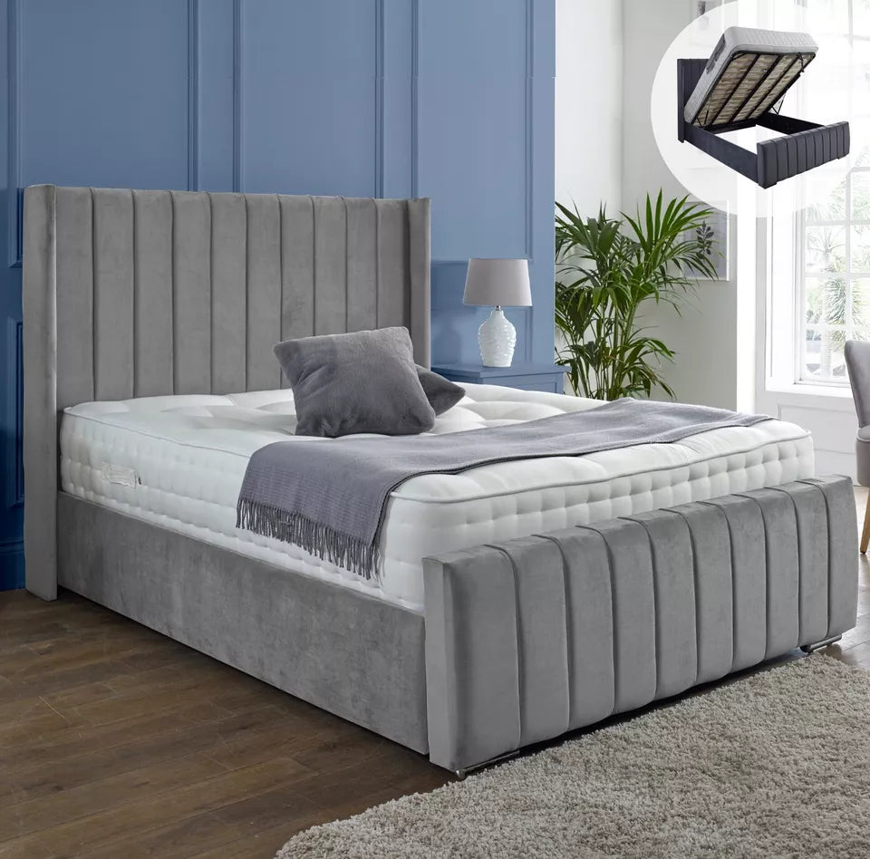 Furnish UK ottoman storage wingback bed in gray velvet with vertical channel tufting and lift-up storage