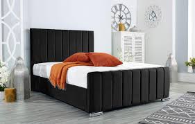 Black panel headboard bed with upholstered frame and modern design by Furnish UK