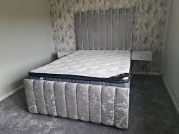 Furnish UK black panel headboard bed with plush velvet upholstery and sturdy frame in bedroom