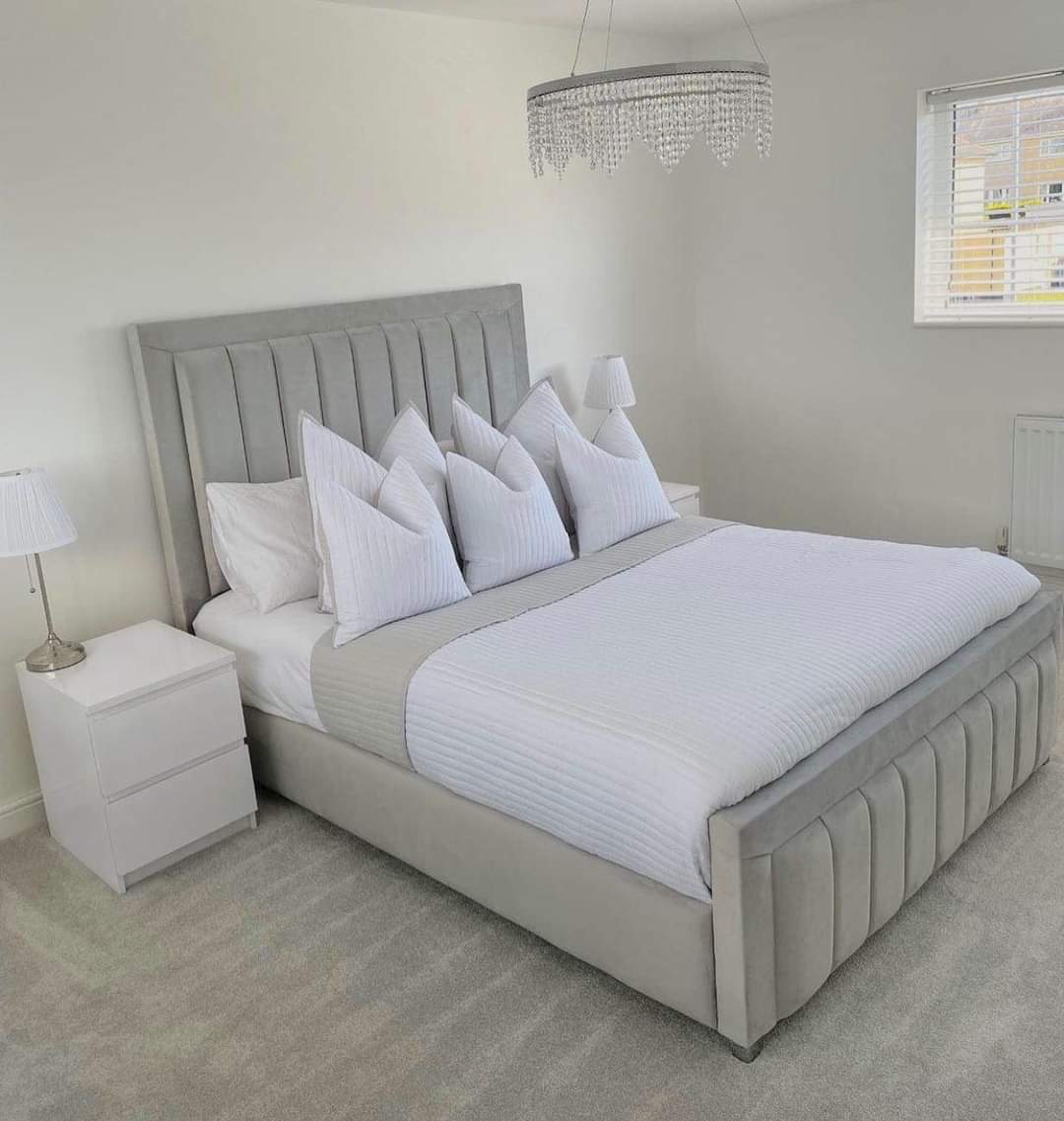 Furnish UK grey bumper panel line bed frame with vertical upholstered panels in a modern bedroom