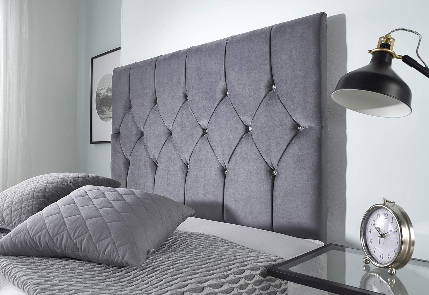 Furnish UK grey chesterfield headboard bed frame with quilted pillows and bedside lamp