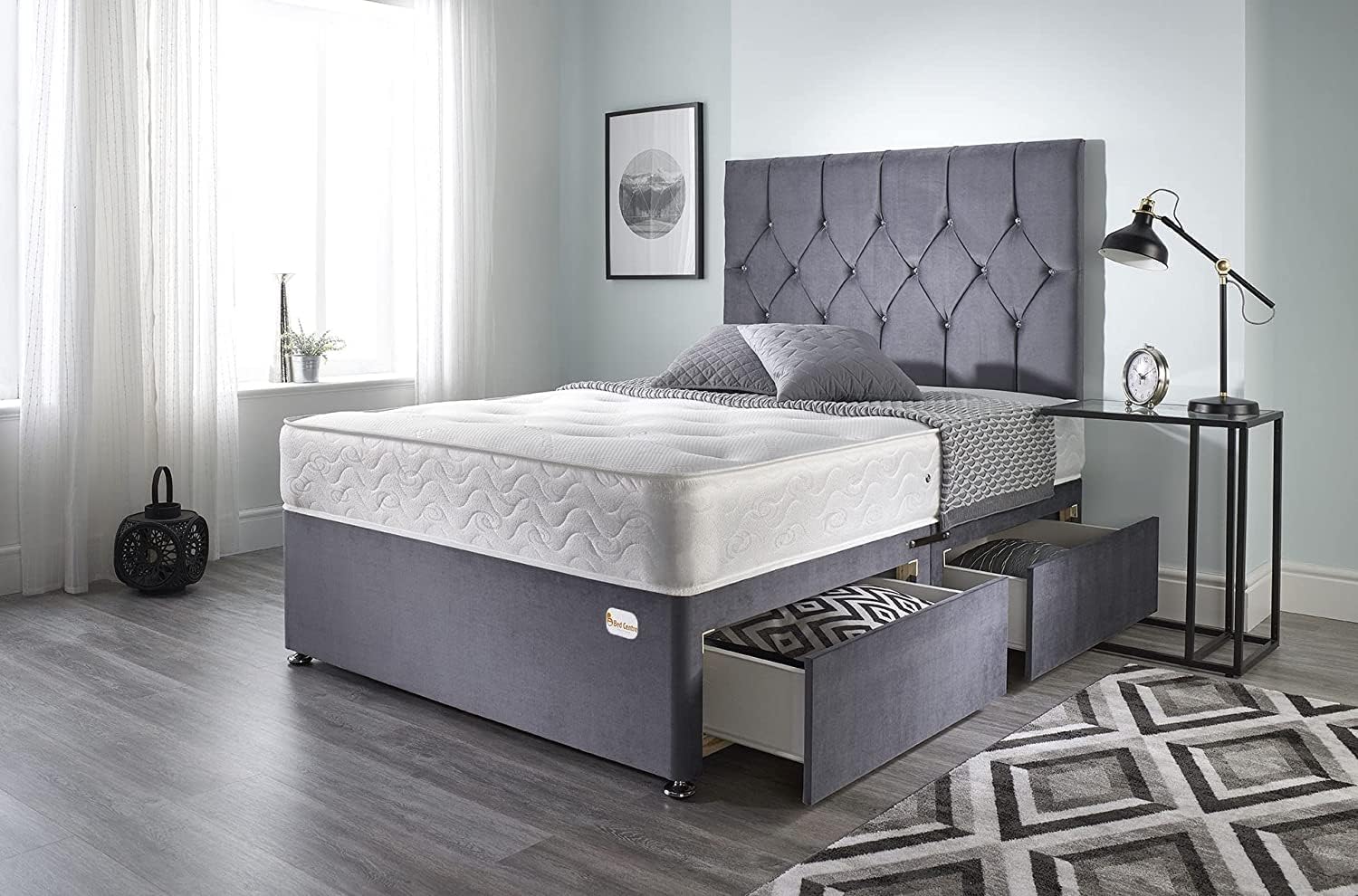 Furnish UK chesterfield headboard bed frame in gray with storage drawers and white mattress in modern bedroom