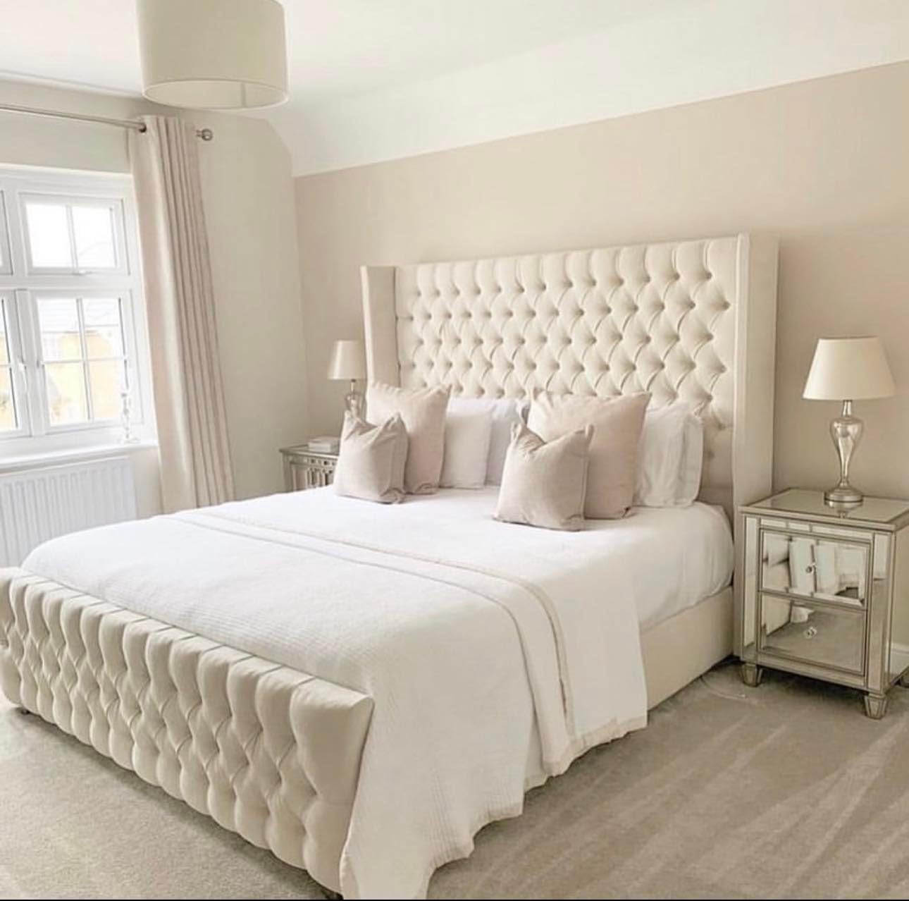Furnish UK beige chesterfield wingback bed with tufted headboard and footboard in a modern bedroom