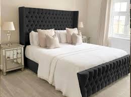 Furnish UK chesterfield wingback bed with black tufted headboard and footboard in modern bedroom