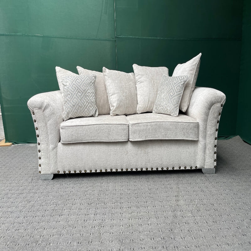 Comfortable L shaped sofa UK by Furnish UK with soft cushions and detailed studs on armrests