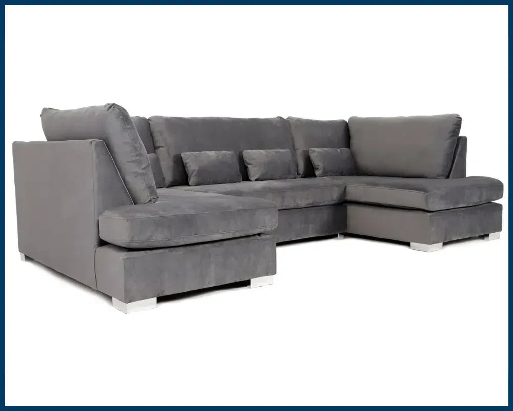 Grey plush velvet U shape sofa from Furnish UK with soft cushions and modern design