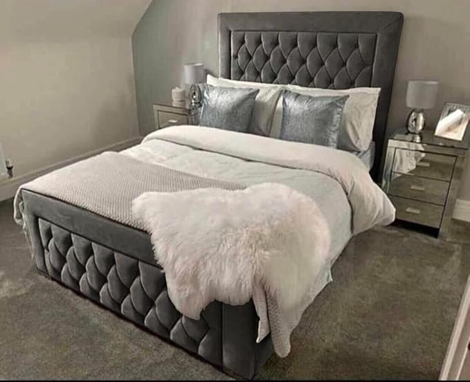 Luxury velvet bed frame in dark grey with tufted headboard and footboard styled in a modern bedroom