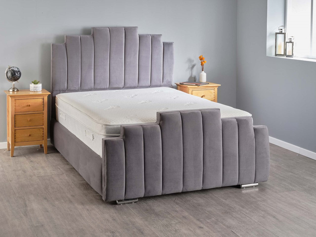 Modern Arizona bed for sale by Furnish UK with grey upholstered headboard and footboard in a bedroom setting