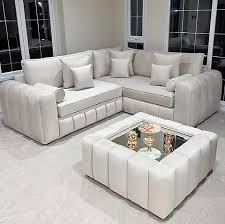 Furnish UK modern L-shaped sofa in light gray fabric with matching ottoman in bright living room