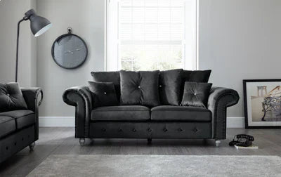 Olympia plush black couch by Furnish UK in modern living room with tufted design and rolled arms