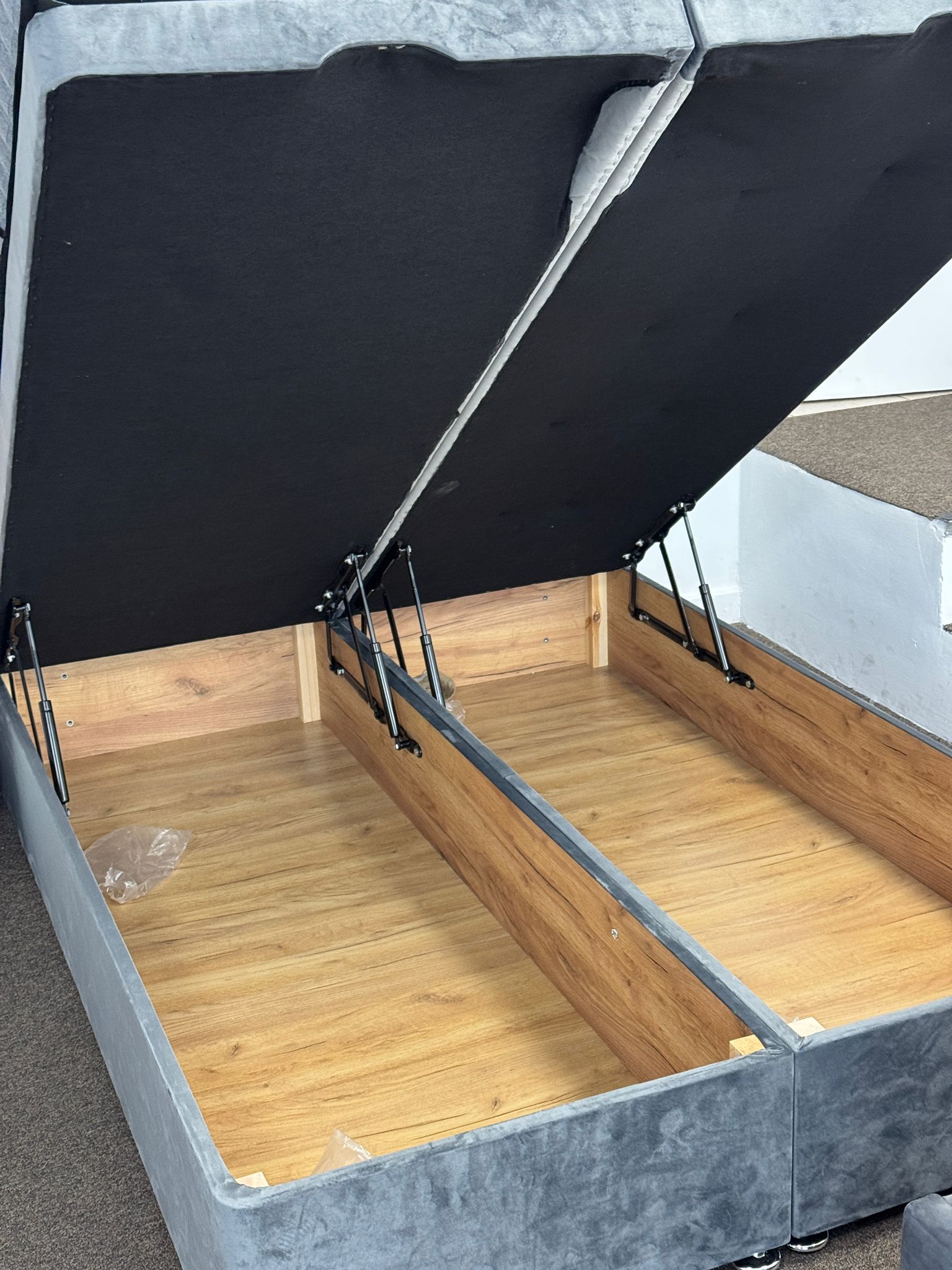 Furnish UK ottoman divan bed with storage open to show spacious wooden storage compartments