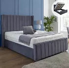Furnish UK ottoman storage wingback bed in gray fabric with raised mattress showing storage space