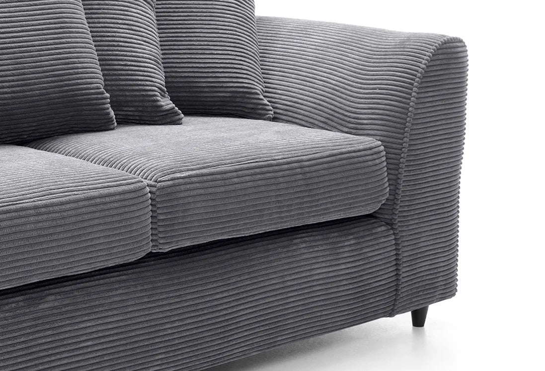 Close-up of DYLAN cord sofa for living room in gray with textured fabric and cushioned armrest