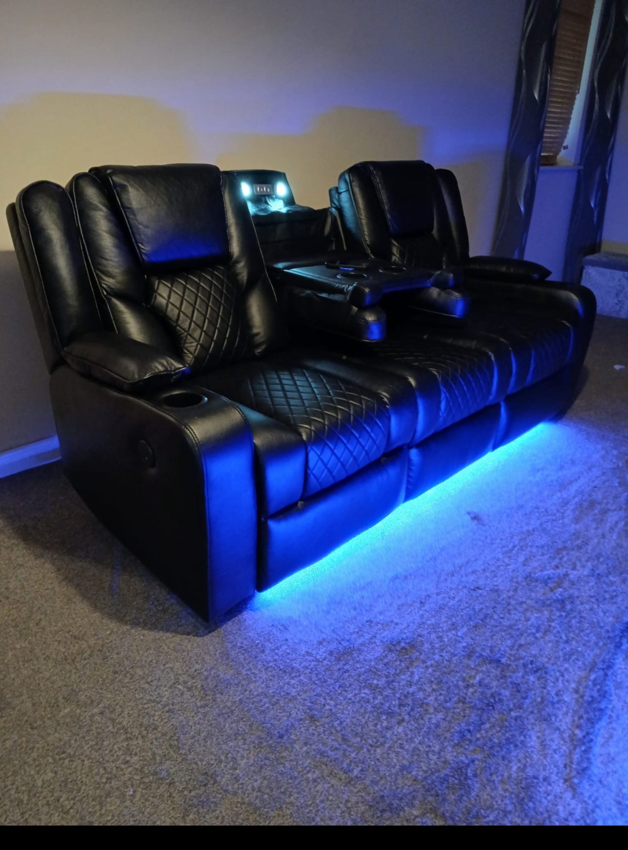 Furnish UK black electric leather recliner sofa with LED lighting and quilted cushions