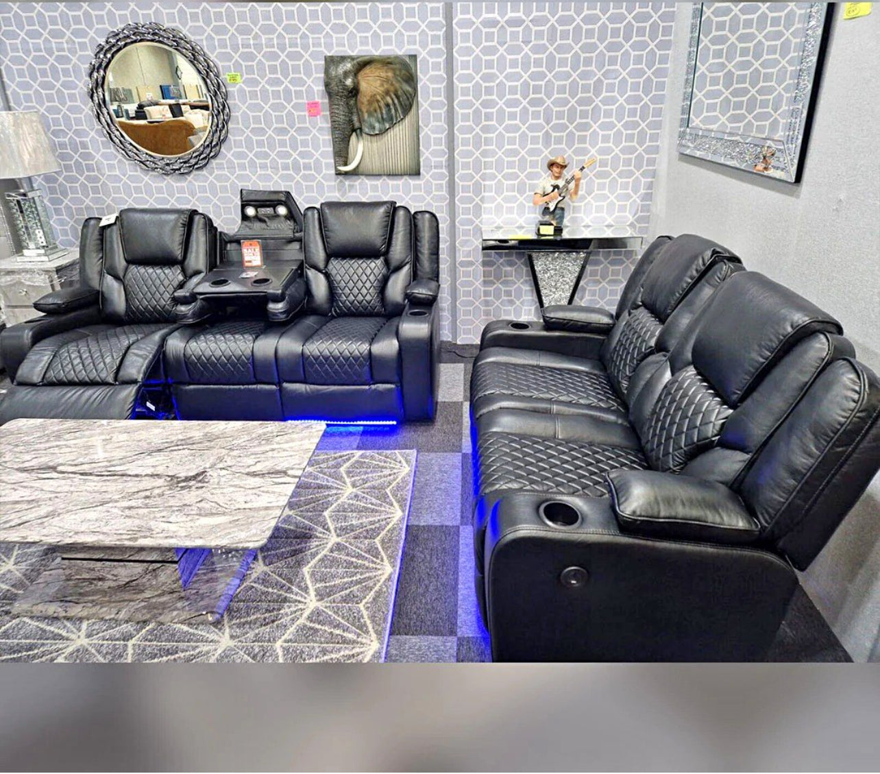 Modern electric leather recliner sofa set with cup holders and blue LED lighting in a stylish living room