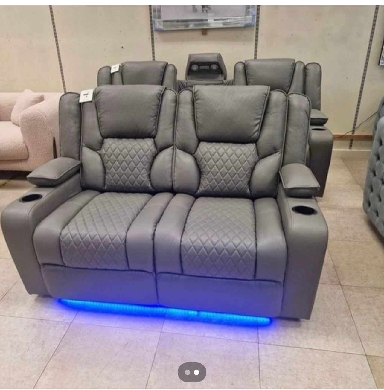 Furnish UK electric leather recliner sofa in gray with quilted seating and blue LED lighting