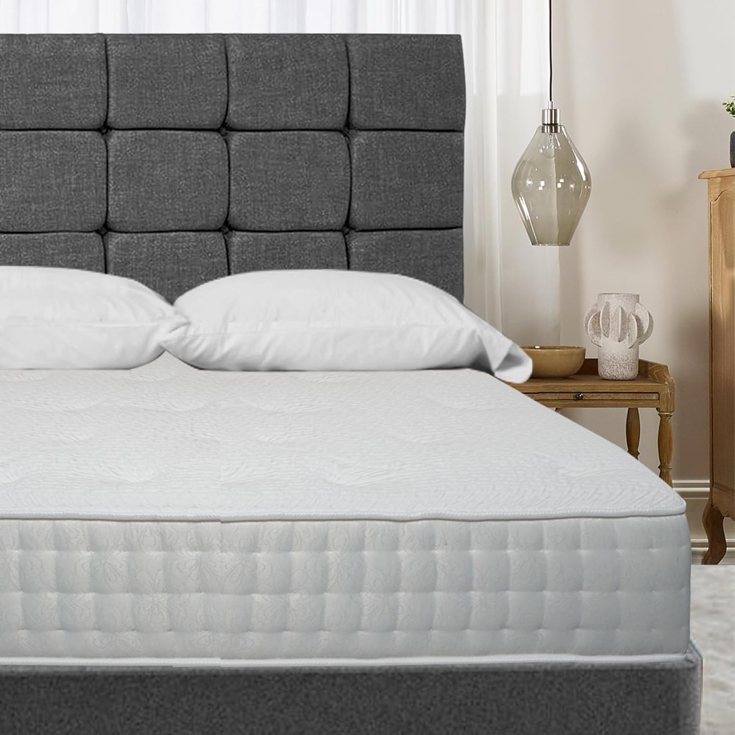Furnish UK modern upholstered divan bed with dark gray tufted headboard and white bedding