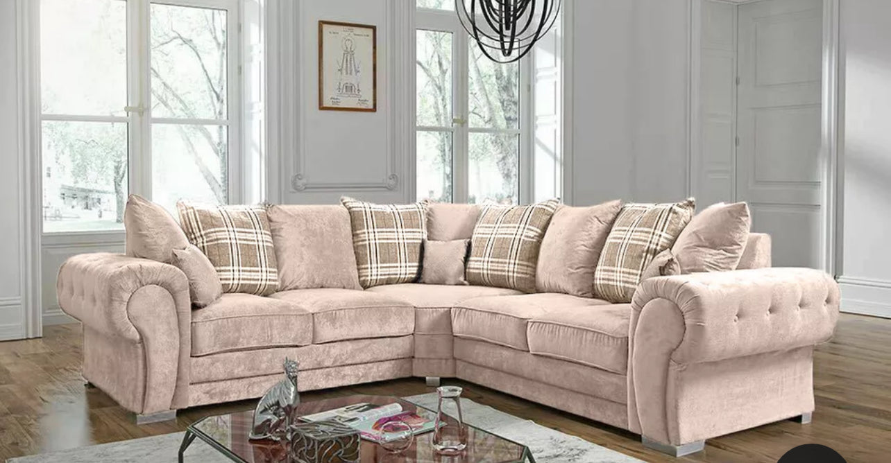 Beige Verona corner sofa by Furnish UK with plush cushions and plaid throw pillows in bright living room
